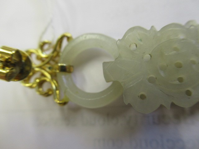 A PAIR OF CHINESE JADE EAR DROPS Image