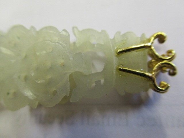 A PAIR OF CHINESE JADE EAR DROPS Image