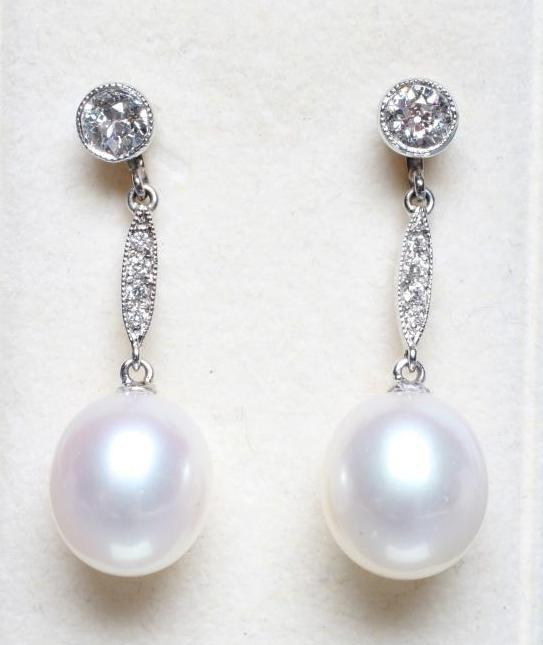 A PAIR OF DIAMOND AND PEARL DROP EARRINGS Image