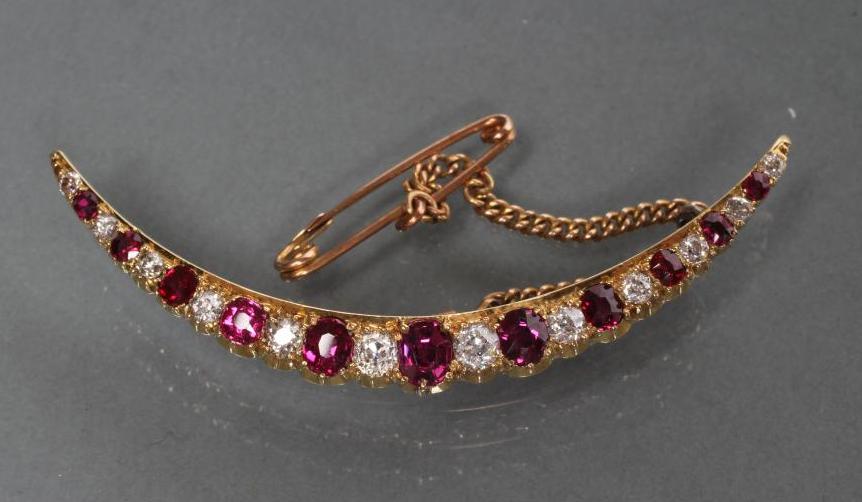 A RUBY AND DIAMOND CRESCENT BROOCH Image