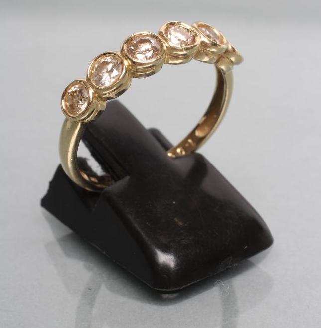 A DIAMOND HALF HOOP RING Image