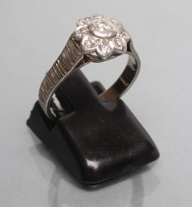 A DIAMOND CLUSTER RING Image