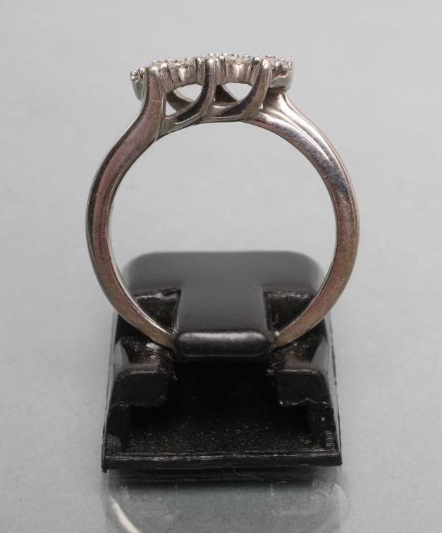 A DIAMOND TRIPLE CLUSTER RING Image