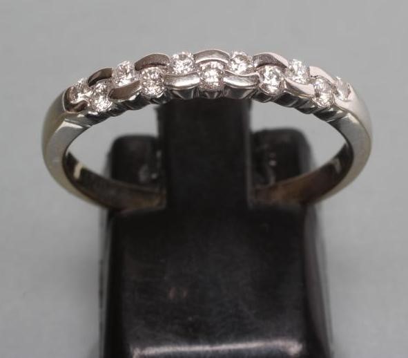 A DIAMOND HALF HOOP RING Image
