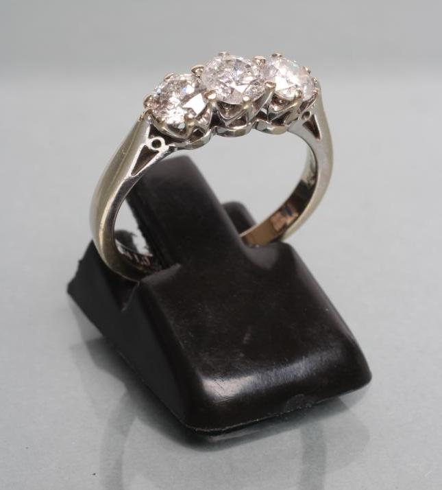A THREE STONE DIAMOND RING Image