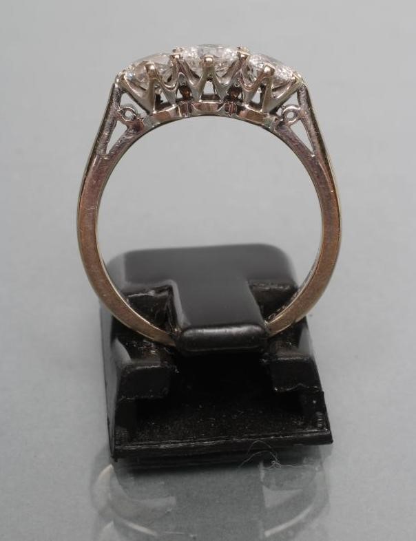 A THREE STONE DIAMOND RING Image