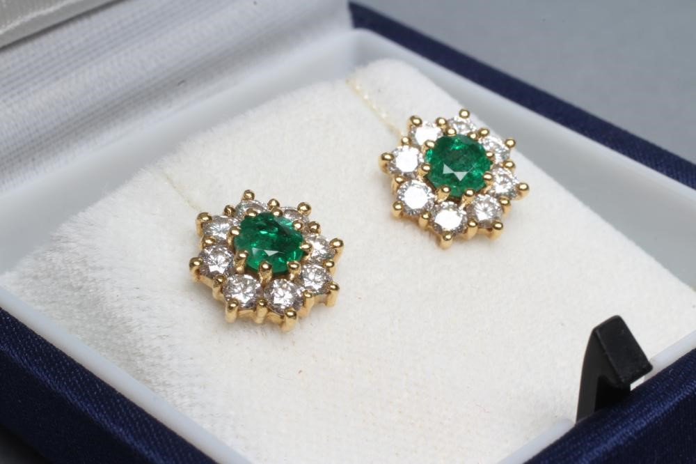A PAIR OF EMERALD AND DIAMOND CLUSTER EAR STUDS Image