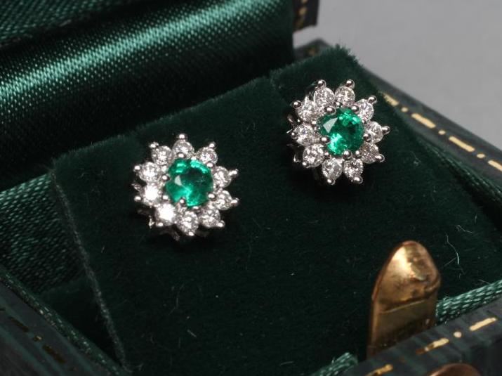 A PAIR OF EMERALD AND DIAMOND CLUSTER EAR STUDS Image
