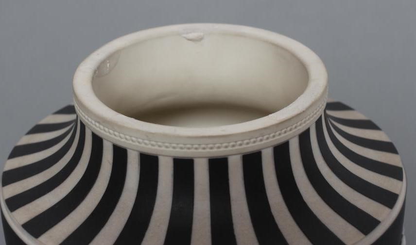 A WEDGWOOD BLACK JASPER DIP "DANCING HOURS" VASE AND COVER Image