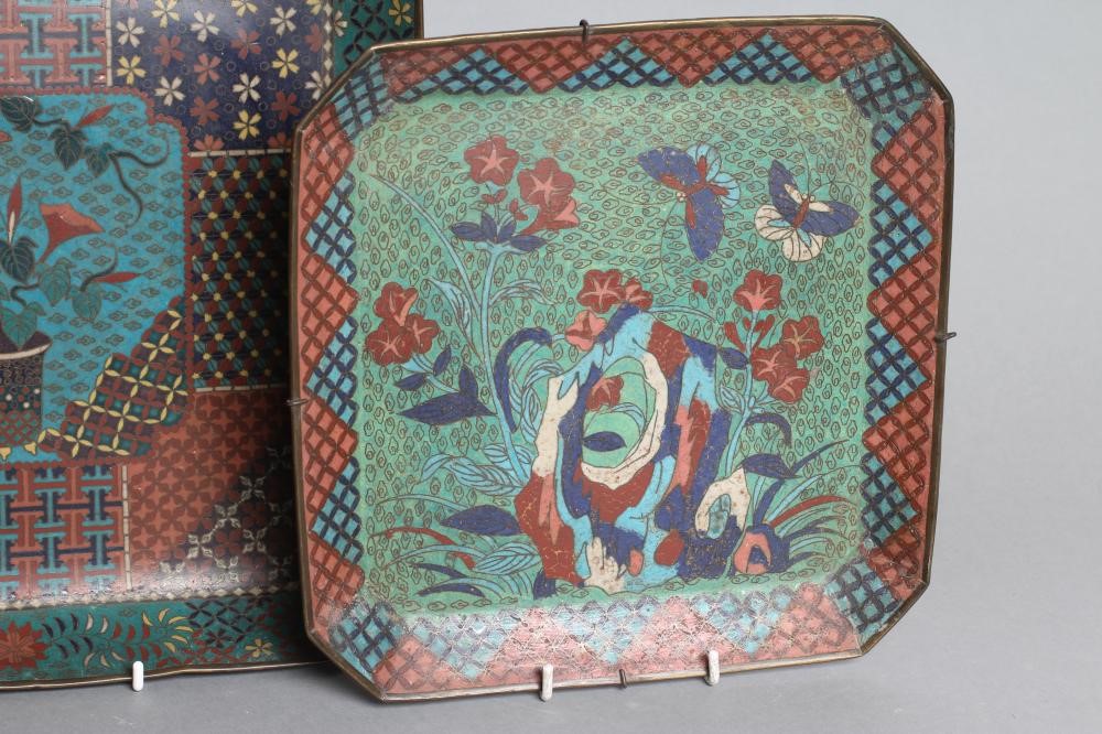 TWO CHINESE CLOISONNE ENAMEL SQUARE TRAYS with canted angles inlaid in sombre colours Image