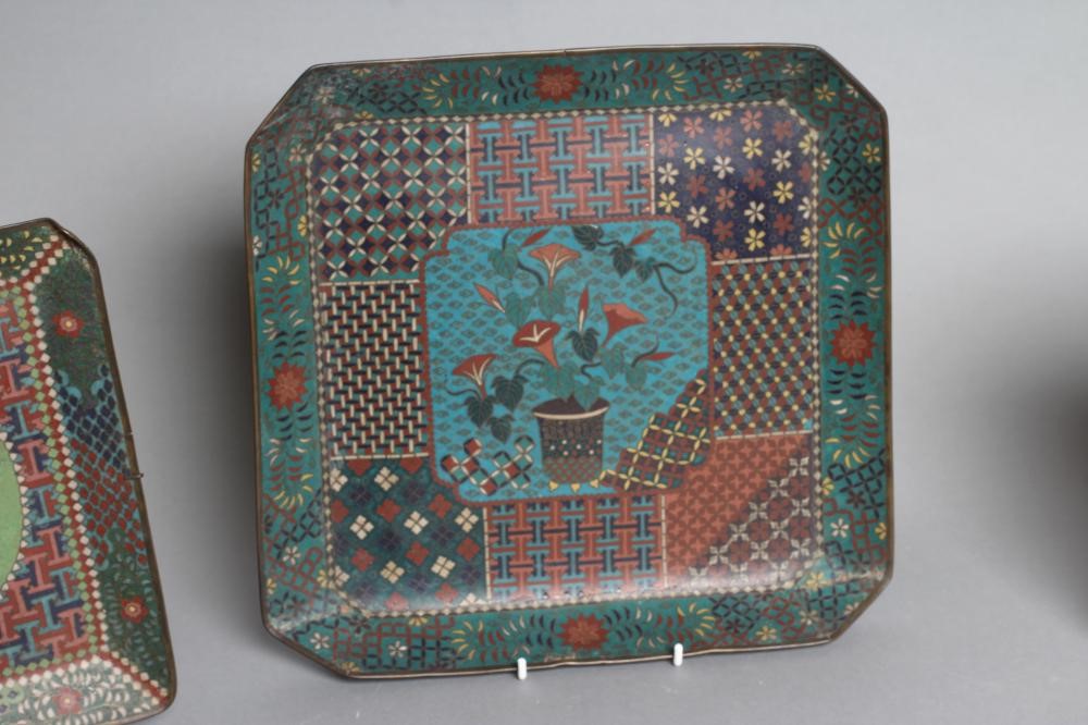 TWO CHINESE CLOISONNE ENAMEL SQUARE TRAYS with canted angles inlaid in sombre colours Image