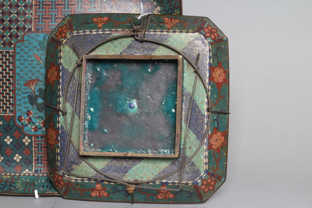 TWO CHINESE CLOISONNE ENAMEL SQUARE TRAYS with canted angles inlaid in sombre colours Image