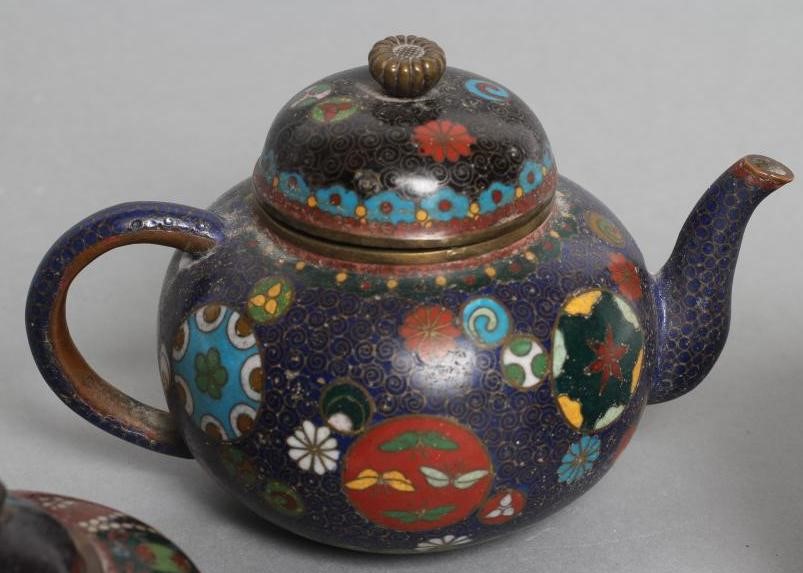 A CHINESE CLOISONNE ENAMEL MINIATURE TEAPOT AND COVER of squat globular form enamelled in colours Image