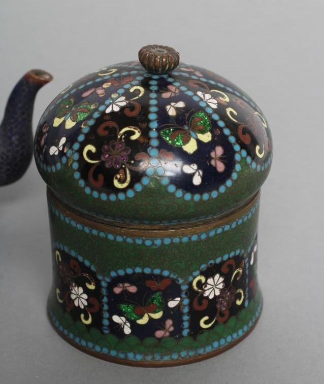A CHINESE CLOISONNE ENAMEL MINIATURE TEAPOT AND COVER of squat globular form enamelled in colours Image