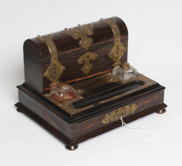 A VICTORIAN COROMANDEL INKSTAND of oblong form with brass mounts Image