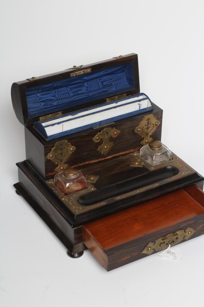 A VICTORIAN COROMANDEL INKSTAND of oblong form with brass mounts Image