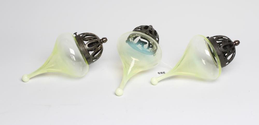 A SET OF THREE VASELINE GLASS LIGHT PENDANTS Image