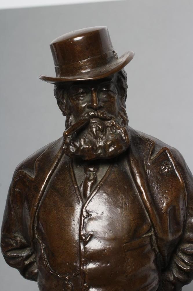 A BRONZE FIGURE OF EDWARD VII modelled standing in riding boots and hat Image