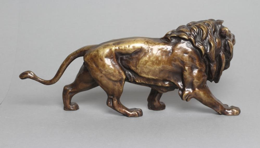 A BRONZE MODEL OF A ROARING LION modelled standing Image