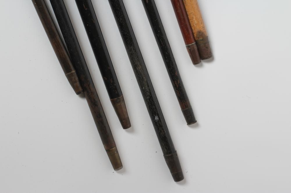 AN EBONISED WALKING CANE with carved wood ball grip Image