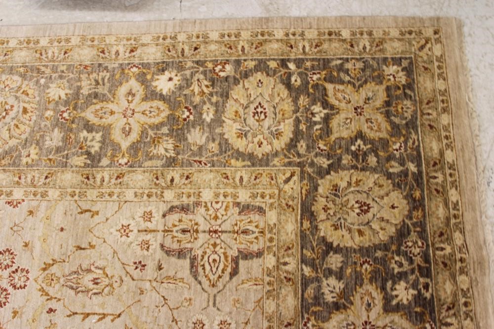 A persian style wool carpet Hartleys Auctioneers & Valuers