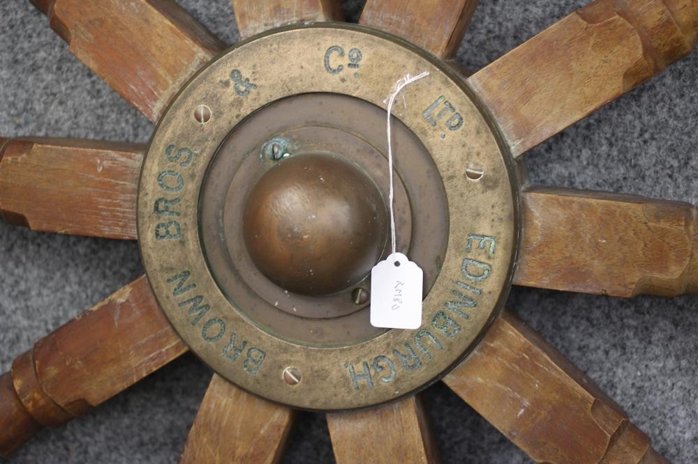A SHIP'S EMERGENCY STEERING WHEEL by Brown Brothers Image