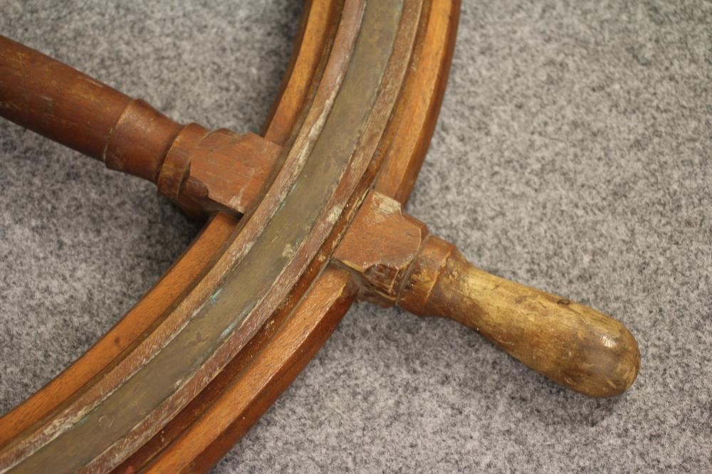 A SHIP'S EMERGENCY STEERING WHEEL by Brown Brothers Image