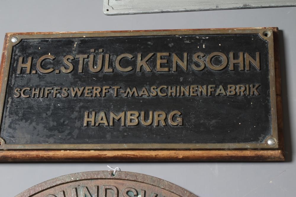 A COLLECTION OF BRONZE SHIP BUILDERS' NAME PLATES including a pair from the Lubecker Flander-Werke Image