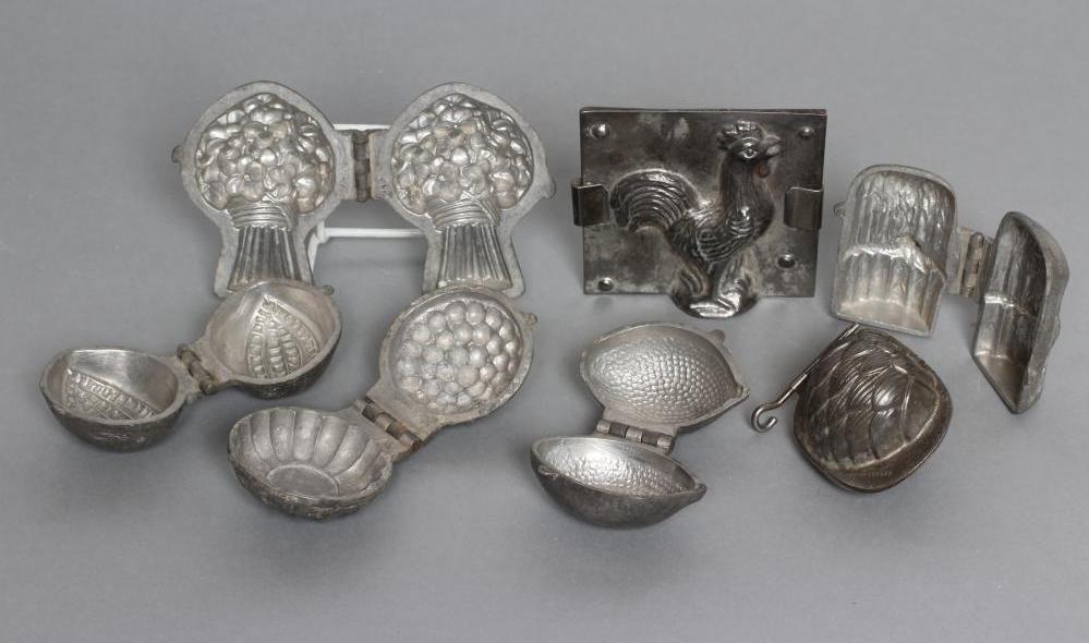 A COLLECTION OF FIVE CAST METAL SORBET MOULDS Image