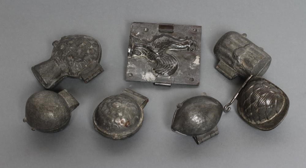 A COLLECTION OF FIVE CAST METAL SORBET MOULDS Image
