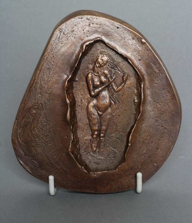 A SMALL BRONZE PLAQUE Image