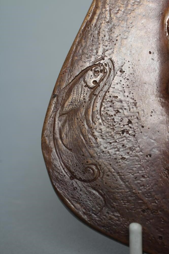 A SMALL BRONZE PLAQUE Image