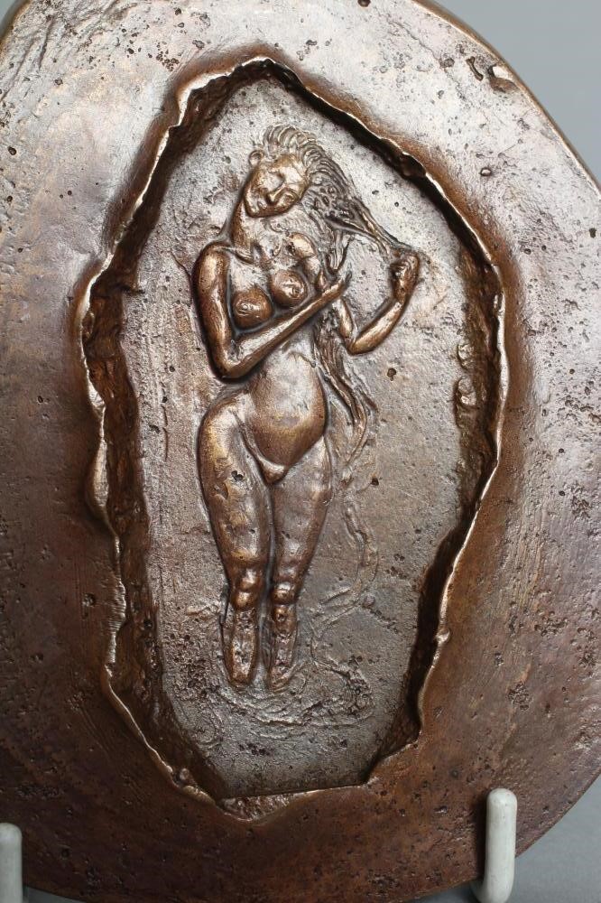 A SMALL BRONZE PLAQUE Image