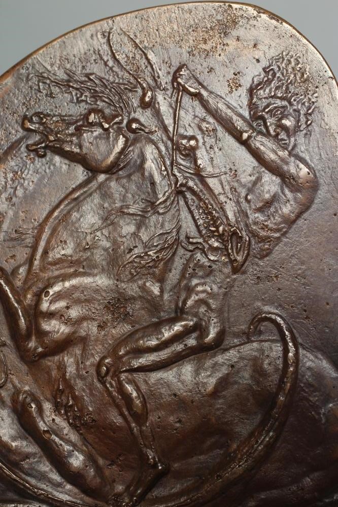 A SMALL BRONZE PLAQUE Image