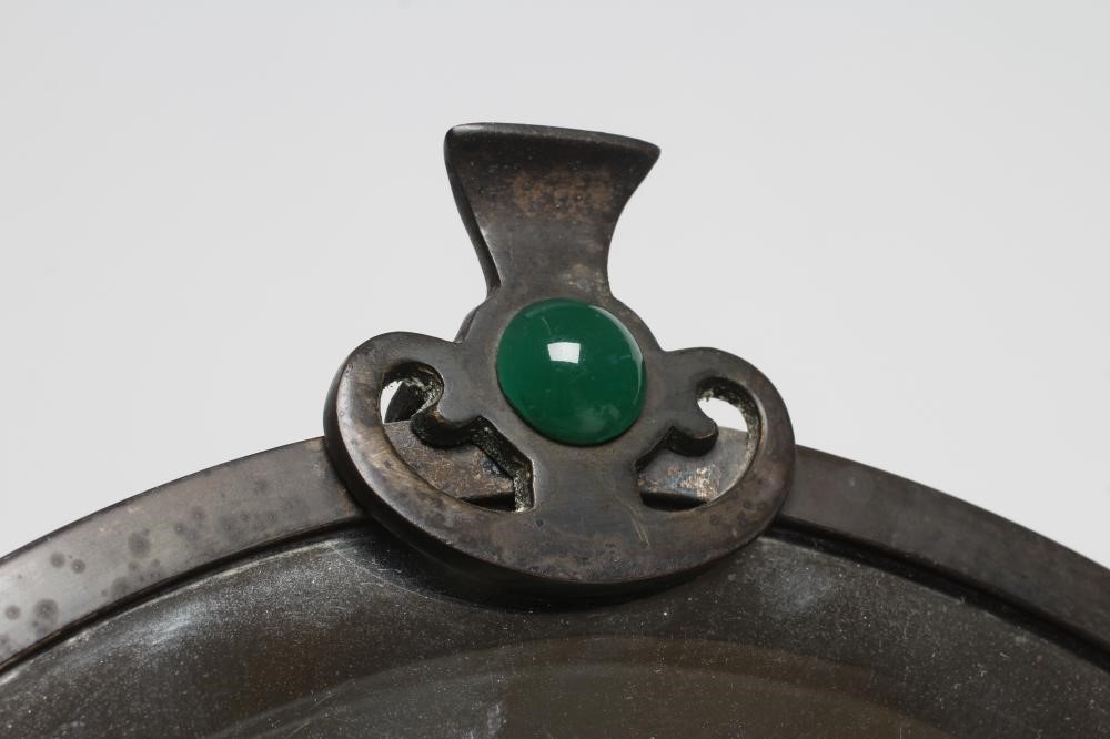 AN ARTS AND CRAFTS SILVERED STEEL FRAMED TOILET MIRROR Image