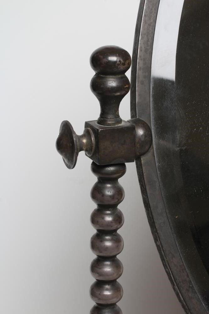 AN ARTS AND CRAFTS SILVERED STEEL FRAMED TOILET MIRROR Image