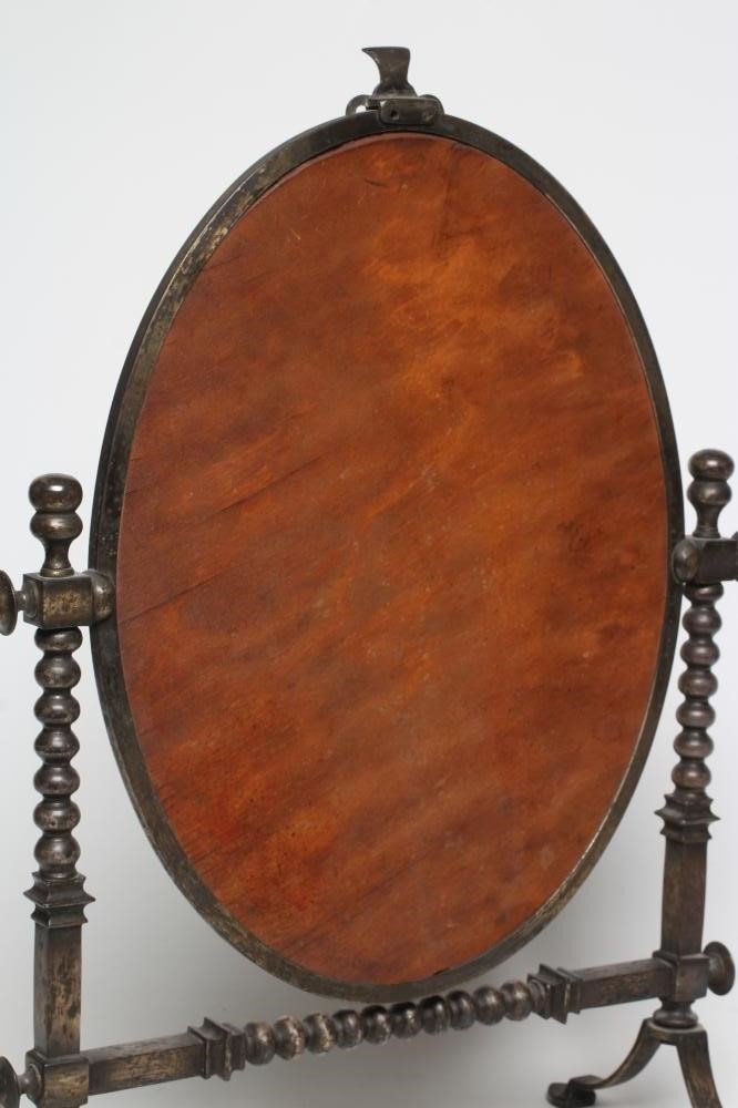 AN ARTS AND CRAFTS SILVERED STEEL FRAMED TOILET MIRROR Image