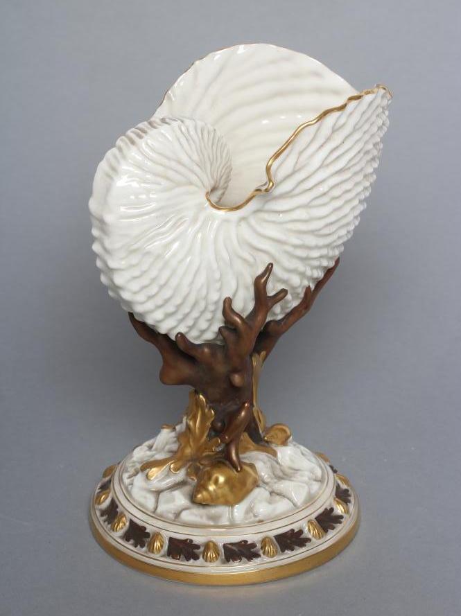 A LATE VICTORIAN ROYAL WORCESTER CHINA NAUTILUS SHELL VASE raised upon bronzed and gilded coral and Image