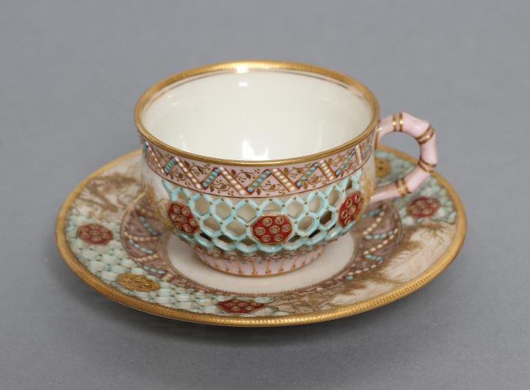 A LATE VICTORIAN ROYAL WORCESTER CHINA RETICULATED CABINET CUP AND SAUCER Image