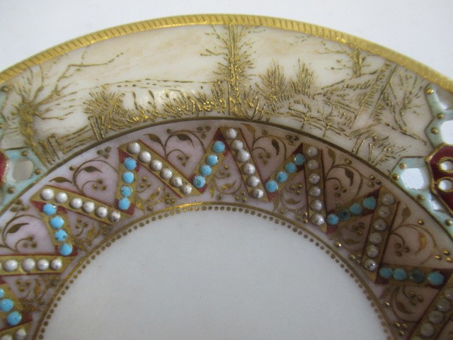 A LATE VICTORIAN ROYAL WORCESTER CHINA RETICULATED CABINET CUP AND SAUCER Image