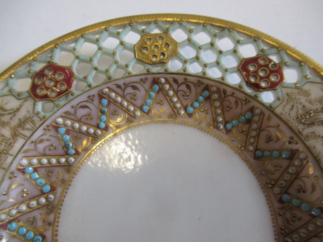 A LATE VICTORIAN ROYAL WORCESTER CHINA RETICULATED CABINET CUP AND SAUCER Image