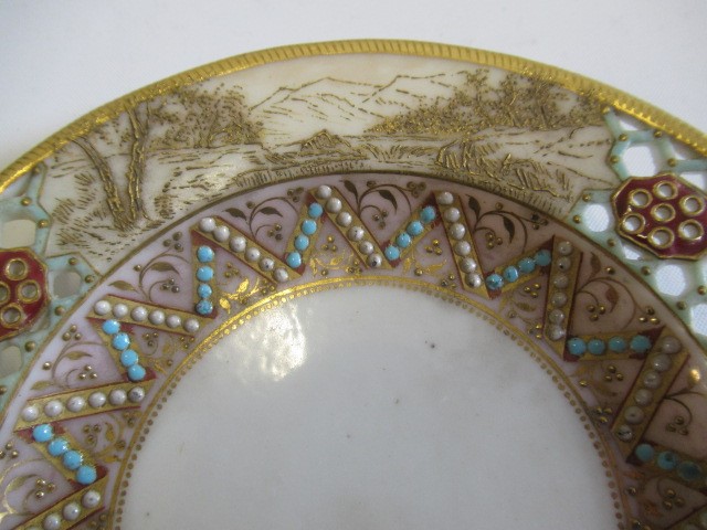A LATE VICTORIAN ROYAL WORCESTER CHINA RETICULATED CABINET CUP AND SAUCER Image