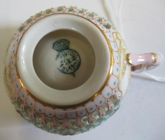A LATE VICTORIAN ROYAL WORCESTER CHINA RETICULATED CABINET CUP AND SAUCER Image