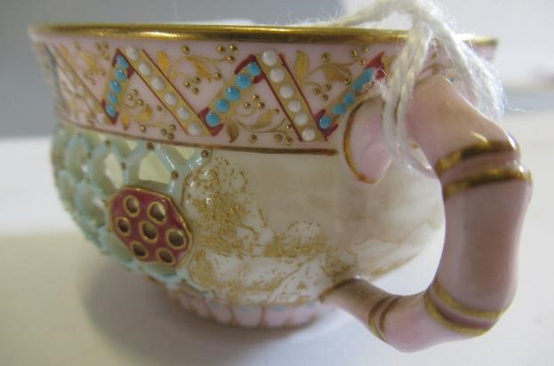 A LATE VICTORIAN ROYAL WORCESTER CHINA RETICULATED CABINET CUP AND SAUCER Image