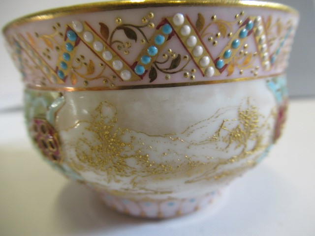 A LATE VICTORIAN ROYAL WORCESTER CHINA RETICULATED CABINET CUP AND SAUCER Image