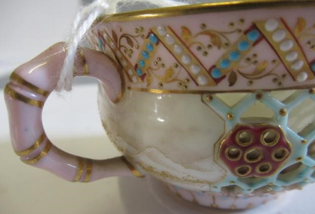 A LATE VICTORIAN ROYAL WORCESTER CHINA RETICULATED CABINET CUP AND SAUCER Image