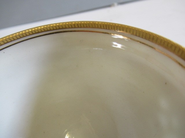 A LATE VICTORIAN ROYAL WORCESTER CHINA RETICULATED CABINET CUP AND SAUCER Image