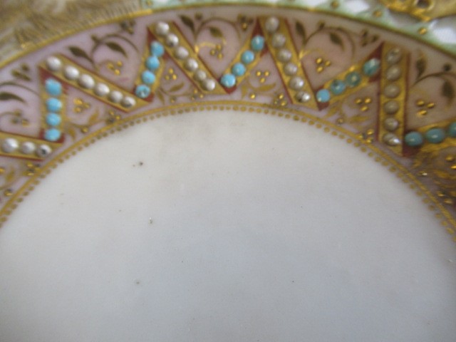A LATE VICTORIAN ROYAL WORCESTER CHINA RETICULATED CABINET CUP AND SAUCER Image