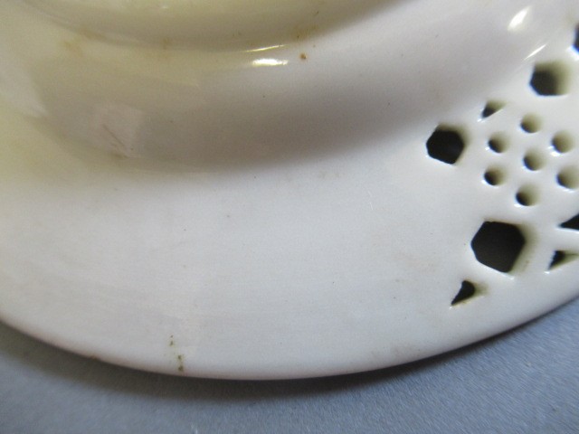 A LATE VICTORIAN ROYAL WORCESTER CHINA RETICULATED CABINET CUP AND SAUCER Image