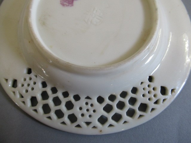 A LATE VICTORIAN ROYAL WORCESTER CHINA RETICULATED CABINET CUP AND SAUCER Image
